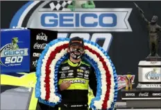  ?? Chris Graythen/Getty Images ?? Ryan Blaney, driver of the No. 12 Ford, celebrates in Victory Lane after the GEICO 500 at Talladega Superspeed­way on Monday in Talladega, Alabama.