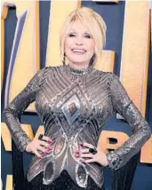  ?? BRIDGET BENNETT/GETTY-AFP ?? Dolly Parton, who is seen March 7, has been inducted into the Rock & Roll Hall of Fame.