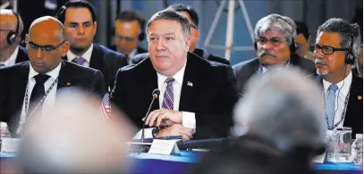  ?? Jacquelyn Martin ?? The Associated Press U.S. Secretary of State Mike Pompeo, center, attends a session of the General Assembly of the Organizati­on of American States on Monday in Washington. He called last month’s elections in Venezuela a “sham.”