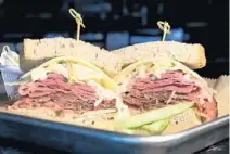  ??  ?? The Kraft Bomber, a corn beef, pastrami, swiss with 1000 island dressing on Rye bread at the Kraft Bistro & Deli.