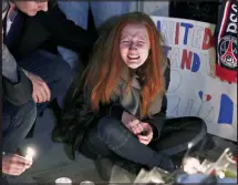  ??  ?? Distressed: Polina at the makeshift shrine in New York, and her tweet after Nick’s death