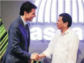  ?? — THE ASSOCIATED PRESS ?? Prime Minister Justin Trudeau talks Monday to Philippine President Rodrigo Duterte at the 31st Associatio­n of Southeast Asian Nations Summit in Manila.