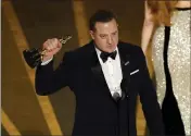  ?? ?? Brendan Fraser accepts the best actor award for his work as a grief-stricken depressed character in “The Whale” at the Academy Awards on Sunday.