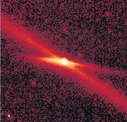  ?? NASA ?? This image, taken by NASA Spitzer Space Telescope, shows the comet Encke riding along its pebbly trail of debris along a diagonal line between the orbits of Mars and Jupiter.