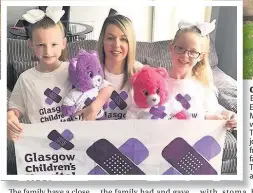  ??  ?? Good deed Emma and Emily McHugh, with mum Tracey, were joined by friends and family on the Teddy Trek, above