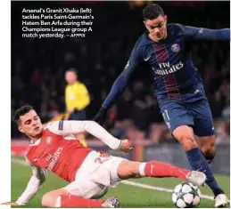  ?? AFPPIX ?? Arsenal’s Granit Xhaka (left) tackles Paris Saint-Germain’s Hatem Ben Arfa during their Champions League group A match yesterday. –
