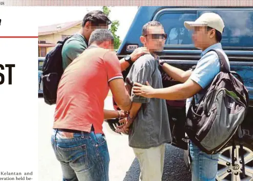  ?? MALAYSIA POLICE PIC COURTESY OF ROYAL ?? Police officers detaining a suspected terrorist during an operation yesterday.