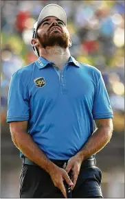  ?? WARREN LITTLE / GETTY IMAGES ?? South African Louis Oosthuizen is frustrated by a missed putt on No. 16, but his 1-over 73 Saturday left him just a stroke behind the leaders.