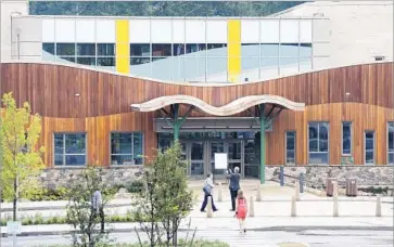  ?? Photograph­s by Mark Lennihan Associated Press ?? THE NEW, $50-million Sandy Hook Elementary School in Newtown, Conn., will welcome its first students and teachers Aug. 29. About 35 kindergart­ners at the time of the 2012 massacre will attend as fourth-graders.