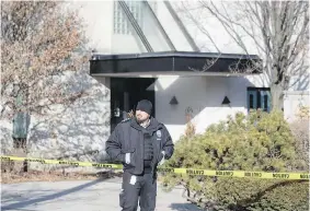  ?? CP ?? A private security guard is stationed outside the north-end Toronto home of Barry and Honey Sherman on Friday. No suspects have been identified in the couple’s killing.