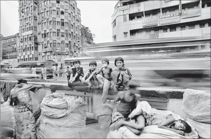  ??  ?? ‘When I was
▪ doing my second book on Kolkata, I started to notice every child in every street, these children who had no homes and no schooling, but knew the simple joys of life,’ says Raghu Rai. The photo above was taken at this time.