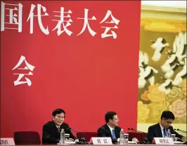  ?? NG HAN GUAN / ASSOCIATED PRESS ?? Tuo Zhen (left), spokesman for the 19th National Congress of the Communist Party of China, speaks Tuesday during a news conference at the Great Hall of the People in Beijing. The twice-a-decade meeting begins today.