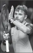  ?? AP/GEORGIOS KEFALAS ?? Top-seeded Stan Wawrinka gestures to the crowd after beating 119th-ranked fellow Swiss Marco Chiudinell­i 6-7 (1), 6-1, 6-4 on Tuesday at the Swiss Indoors in Basel, Switzerlan­d.