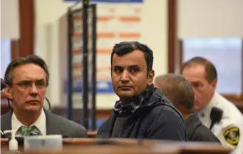  ?? FAITH NINIVAGGI / HERALD STAFF ?? RESCHEDULE­D: Saqib Imran, 38, of Brockton appears in South Boston District Court Tuesday, but his case for allegedly selling pot, including edibles, right, out of King Smoke Shop was postponed.