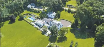  ?? Contribute­d photo ?? The Belle Haven beauty at 23 Smith Road presides over more than 5 acres of land, waterfront on Greenwich Harbor. The estate — the former home of Oliver Mead — is listed by Houlihan Lawrence for $39.5 million.