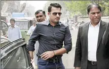  ?? (AP) ?? In this March 21, 2017 file photo, Pakistani provisiona­lly suspended cricketer Sharjeel Khan (center), arrives at the office of Federal Investigat­ion Authority for recording his statements, in Lahore, Pakistan. Pakistan Cricket Board’s anti-corruption...