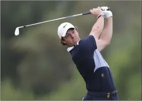  ?? KAMRAN JEBREILI - THE ASSOCIATED PRESS ?? Rory McIlroy of Northern Ireland watches his ball on the 3rd hole during the first round of the DP World Tour Championsh­ip golf tournament in Dubai, United Arab Emirates, Thursday, Nov. 21, 2019.