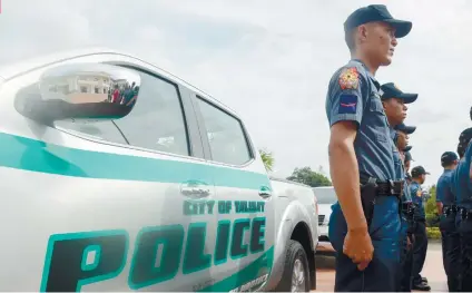 ?? SUNSTAR FOTO/ ARNI ACLAO ?? SUPPORT. Despite the allegation­s against the city police as being involved in the illegal drug trade, Talisay City continues its support to its police force by giving two new patrol cars.