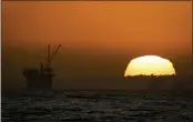  ?? CHRIS CARLSON — THE ASSOCIATED PRESS FILE ?? Offshore oil-drilling platforms near Huntington Beach are seen at sunset.