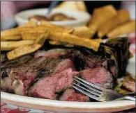  ?? Democrat-Gazette file photo ?? The steaks — this T-bone, for example — are massive at Doe’s Eat Place in Little Rock.