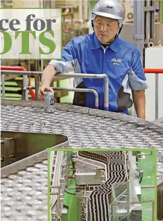  ??  ?? Asahi Breweries employee Kiyoshi Sakai checks the production line at an Asahi factory near Tokyo. Sakai, who has worked at Asahi for 29 years, is grateful for the helping hand from automation.