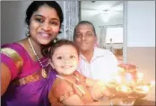  ??  ?? Raj Karpoormat­h with his wife, Pruthei, and daughter, Divi, during last year’s Diwali celebratio­ns at their home in Glenwood.