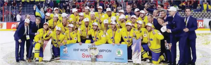  ??  ?? COLONGE: Members of team Sweden celebrate following the Ice Hockey World Championsh­ips final match between Canada and Sweden in the LANXESS arena. —AP