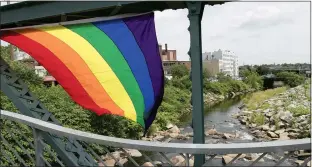  ?? JOHN LOVE / SENTINEL & ENTERPRISE FILE ?? A rainbow pride flag was attached to the bridge over the Nashua River in front of Riverfront Park in Fitchburg during the 2019 event.
