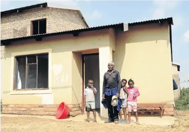  ?? /PHOTOS/MDUDUZI NDZINGI ?? Nomzi Nqotholo has occupied one of the RDP housing units at Kliptown Extension 11, Soweto. He lives with his wife and five children.