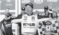  ?? JOHN RAOUX AP ?? Brad Keselowski celebrates in Victory Lane after winning the first of two Daytona 500 qualifying auto races on Thursday night.