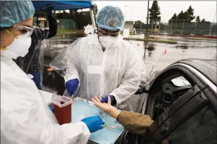  ?? Courtesy photo ?? USC and Public Health conduct COVID-19 antibody testing with drive-thru sites located across Los Angeles County in April. While awaiting a vaccine, some are turning to the testing for answers.