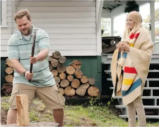  ?? Alliance Films ?? Tyler Labine, left, and Malin Akerman star in Cottage Country, which has more twists than a country road.