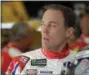  ?? CHUCK BURTON — AP ?? Kevin Harvick looks out from the garage before practice May 26 at Charlotte Motor Speedway.