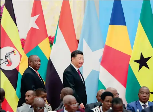  ?? Photo: AFP ?? Chinese President Xi Jinping (right) walks with South African President Cyril Ramaphosa to attend the Forum on China-Africa Cooperatio­n’s Round Table Conference at the Great Hall of the People in Beijing on Tuesday.