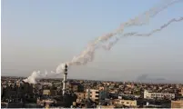  ?? (Abed Rahim Khatib/Flash90) ?? TERROR GROUPS launch a large volley of rockets from the Gaza Strip at central Israel earlier this week.