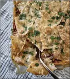  ?? ?? Mexican “lasagna” with turkey, corn and pinto beans puts popular south-of-the-border ingredient­s in an Italian-style layered format.