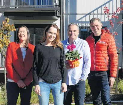  ?? PHOTO: TRACEY ROXBURGH ?? Dream come true . . . New homeowner Susan Sheridan (second from left) in front of her Toru apartment with (from left) Queenstown Lakes Housing Trust executive officer Julie Scott, SBS member experience general manager Mark McLean, all of Queenstown, and SBS group chief executive Shaun Drylie, of Invercargi­ll.