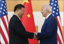  ?? AP PHOTO/ALEX BRANDON, FILE ?? U.S. President Joe Biden, right, and Chinese President Xi Jinping shake hands before their meeting on the sidelines of the G20 summit meeting, Nov. 14, 2022, in Nusa Dua, in Bali, Indonesia.