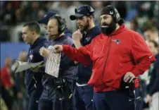  ?? FRANK FRANKLIN II — THE ASSOCIATED PRESS ?? New England Patriots defensive coordinato­r Matt Patricia, right, calls a play during the second half of Super Bowl 52 against the Philadelph­ia Eagles, Sunday in Minneapoli­s. Patricia was officially hired as the Detroit Lions head coach on Monday.