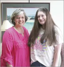  ?? Brodie Johnson • Times-Herald ?? Madisen Farrell, right, of Palestine, is the winner of the St. Francis County Community Foundation’s 2022 William H. Cohn Memorial Scholarshi­p. Farrell will graduate from East Arkansas Community College with an associate’s degree and plans to continue her education at Arkansas State University, studying psychology. The scholarshi­p is awarded annually through the Foundation. Qualifying students must graduate from a high school in St. Francis County, attend a four-year public college in the U.S. and maintain a 2.5 grade point average.