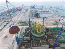  ?? JIANG KEHONG / XINHUA ?? Constructi­on of a third-generation reactor, using technology known as Hualong One, starts in Fuqing, East China’s Fujian province.