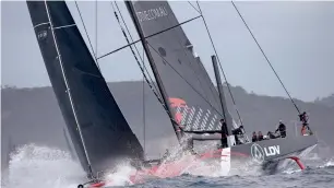  ?? AP ?? Supermaxi LDV Comanche enters open water during the start of the Sydney to Hobart race. —
