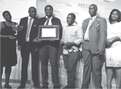  ??  ?? DSK Electrical representa­tives (first four from left) who stood in for Outstandin­g Megafest Businessma­n of the Year Mr Worthwhile Mugabe