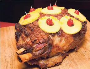  ??  ?? Grace pineapple-glazed smoked ham.