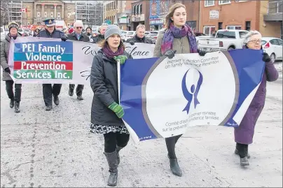  ?? JIM DAY/THE GUARDIAN ?? Leading the charge in Charlottet­own Wednesday in the Walk in Silence for Victims of Family Violence are Family Violence Prevention Services executive director Danya O’Malley, left, UPEI student and survivor of violence Taya Nabuurs and Ann Sherman, chairwoman of the Premier’s Action Committee on Family Violence Prevention.