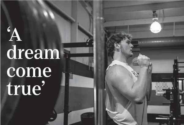  ?? PHOTOS BY JEFF FAUGHENDER/COURIER JOURNAL ?? North Oldham offensive lineman Gradey Anthony worked out in the weight room before a March practice.