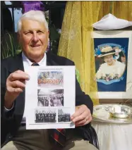  ?? ?? West Kelowna's Carl Zanon, who was a 16-year-old sea cadet from Nelson when he attended Queen Elizabeth II’s coronation in 1953, shows off some photos from the event.