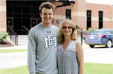  ?? (Submitted Photo) ?? East Mississipp­i Community College sophomore John Ross Briggs, at left, is the fourth generation of the Briggs family to attend the college. His mother Lisa Briggs, at right, has worked for the college for 12 years.