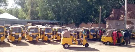  ?? Photo: EFCC ?? Some of the 53 commercial tricycles recovered by EFCC operatives from a contractor, about to be handed over to the Zamfara State Government yesterday. About N1.2 billion was awarded to Kynco and Wadatau firms to supply 1000 tricycles but 947 were allegedly supplied before the expiration of the immediate past administra­tion