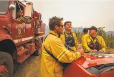  ?? Peter Dasilva / special to The Chronicle ?? Incident commanders fighting the Nuns Fire plan for changing weather conditions in the Mount Veeder area of the Napa Valley.